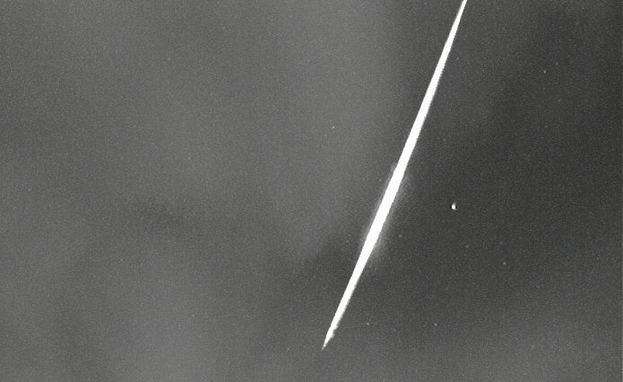 Beautiful Virginid fireball behind the clouds on 28 April at 23:50 UT